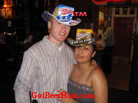 Another beautiful couple wearing their favorite beer hat