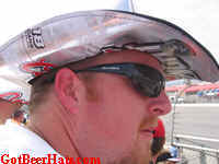 Anyone know who that cool guy and his beer hat is?